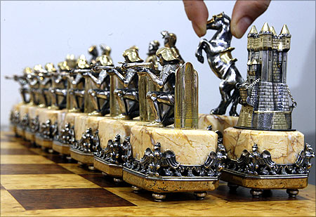 Chess of the Middle Ages exhibit, made of gold and silver, is displayed at an exhibition.