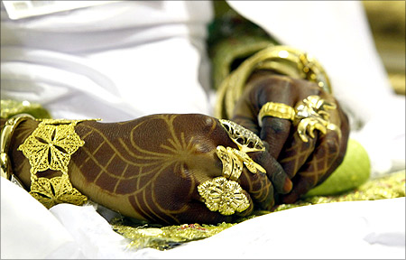 The hands of a bride are seen during a wedding ceremony at an area in Bab al-Aziziyah compound in Tripoli.