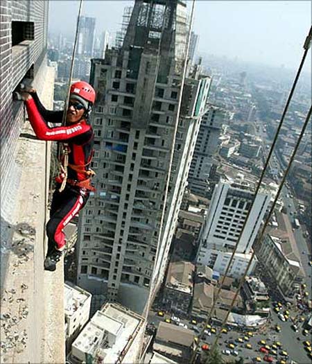 Gaurav Sharma, a martial arts trainer, climbs the 45 storey 'Shreepati Arcade' in Mumbai.