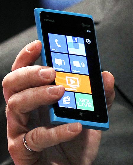 Nokia CEO Stephen Elop introduces the Nokia Lumia 900 smartphone at a Nokia press event at the Consumer Electronics Show.
