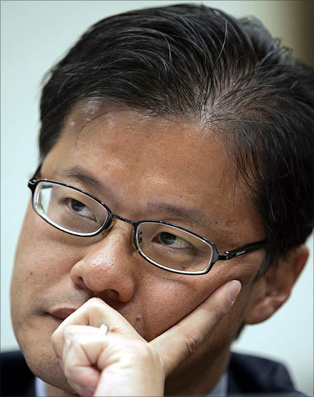 Jerry Yang listens to a question during a hearing before the U.S. House Foreign Affairs Committee.