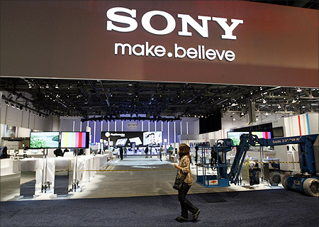Workers prepare the booth for Sony at the Consumer Electronics Show opening in Las Vegas.