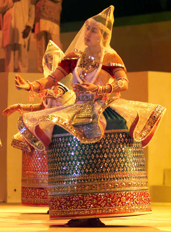 Folk dancers from Manipur in traditional attire perform in Ahmedabad.