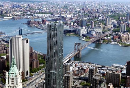 The Brooklyn Bridge (R) and Manhattan Bridge is seen from the 90th story of One World Trade Center in New York.