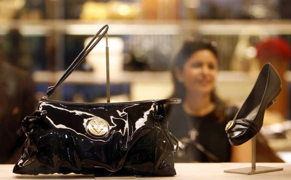 A woman looks at the products at a Gucci showroom in Mumbai.