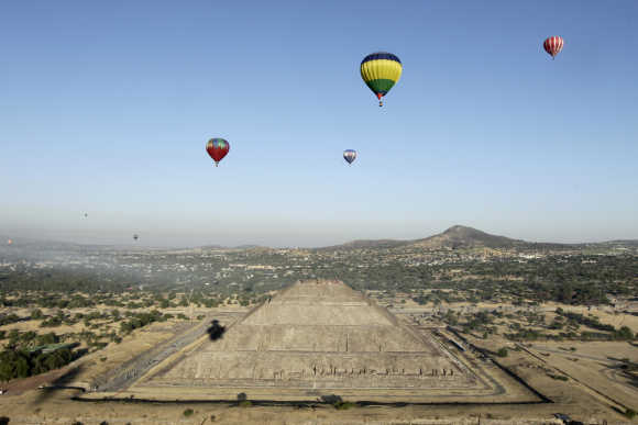 Hot air balloons float above the Pyramid of the Sun of Teotihuacan outside Mexico City.