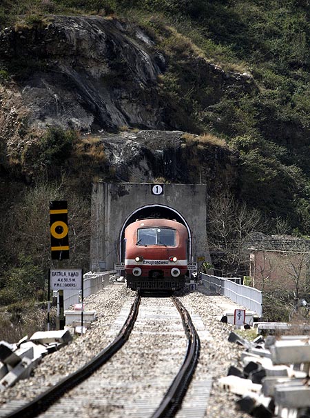 passenger train travelling the Jammu-Udhampur rail line comes out of a tunnel on the outskirts of Jammu.