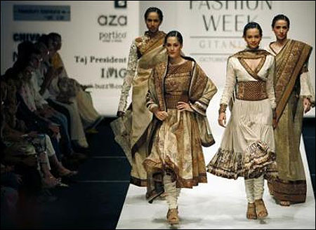 Models present creations by Indian designers Ekta and Ruchira.