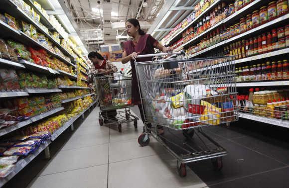 Women shop for instant noodles at a retail supermarket in Mumbai.