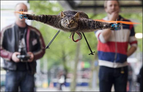 The Orvillecopter by Dutch artist Bart Jansen (L) flies in a gallery during the KunstRAI art festival in Amsterdam.