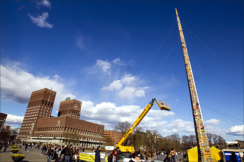A tower created from Lego bricks is pictured completed in front of Oslo City Hall.