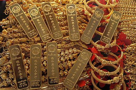 Gold bars and jewellery are displayed in a shop in Bangkok's Chinatown.