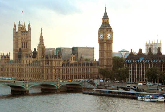 Big Ben and the Palace of Westminster are seen from the Millennium Wheel on the river Thames in London.