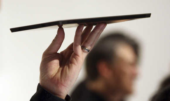A Microsoft representative holds the Surface tablet in Los Angeles, California.