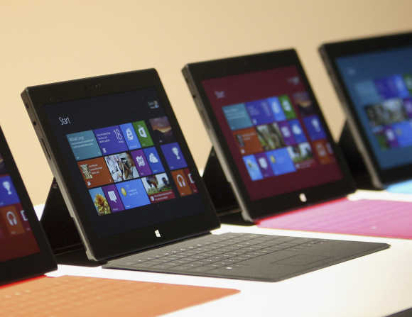 Surface tablet computers with keyboards are displayed at its unveiling in Los Angeles.