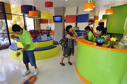 A guest is seen at the lobby of a budget hotel in the Indonesian resort island of Bali.