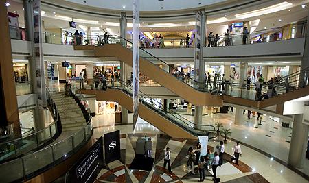 People stroll in Inorbit mall in Mumbai.