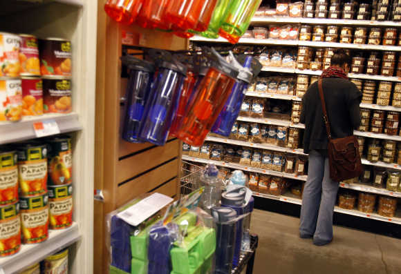 A woman shops for groceries at a Whole Foods supermarket in New York.