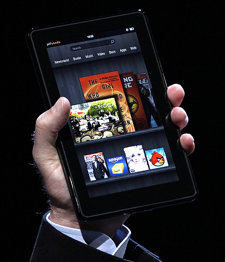 Amazon CEO Jeff Bezos holds up the new Kindle Fire at a press conference