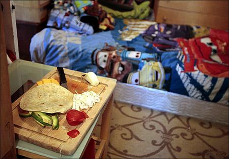 Eight-year-old Dylan Burger's bedroom doubles as a kitchen in a converted garage in Los Angeles, California.