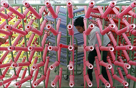 An employee works inside a newly inaugurated textile mill in the western Indian city of Ahmedabad.