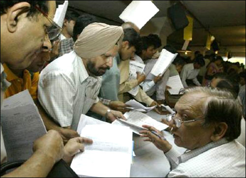 Tax payers line up to submit their income tax returns in New Delhi.