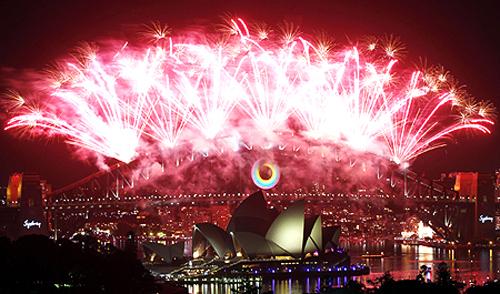 Fireworks explode over the Sydney Harbour Bridge and Opera House during a pyrotechnic show to celebrate the New Year.