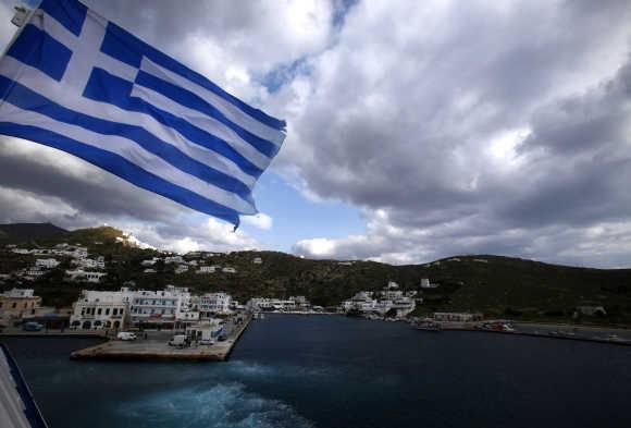 The island of Ios is seen from the Blue Star Paros vessel as it departs from the island during a nine-hour trip to the Greek islands of Paros, Naxos, Ios and Santorini, in the Aegean Sea.