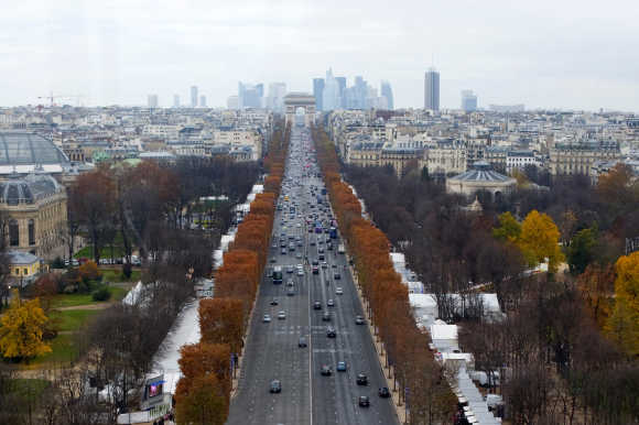A view of the Champs Elysees Avenue and the Arc de Triomphe monument in Paris