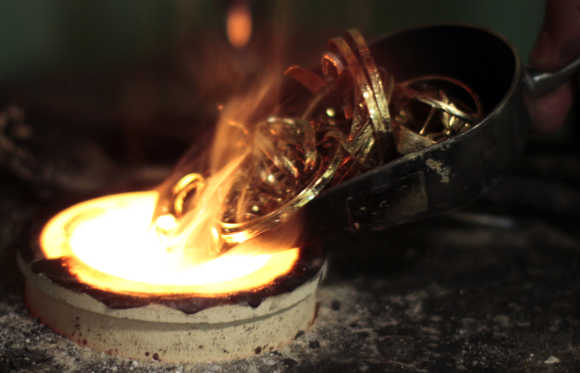 A man melts down gold jewellery in Los Angeles, California.
