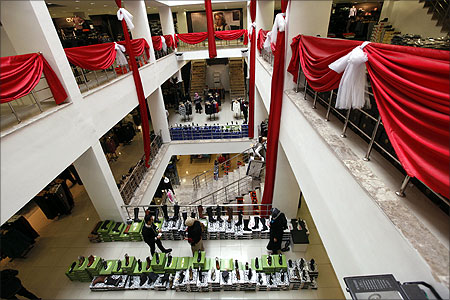 People walk inside a shopping mall in Baghdad.