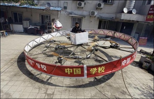 Local farmer Shu Mansheng hovers above the ground in his self-designed and homemade flying device during a test flight in front of his house in Dashu village on the outskirts of Wuhan, Hubei province, China.