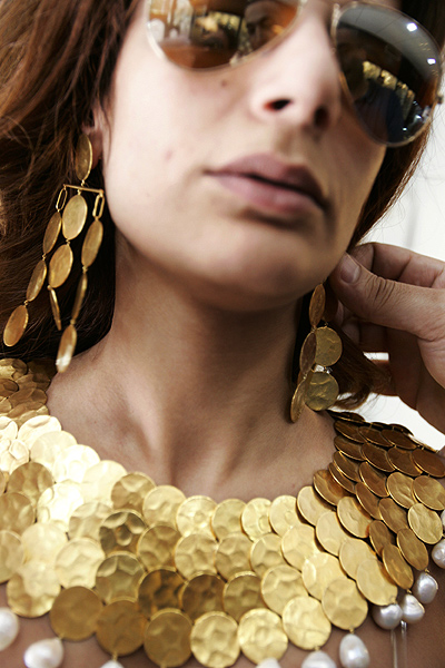 customer wears a jewellery set at a jewellery shop in a shopping district in Beirut.