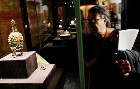 A woman looks at the Lilies of the Valley Egg at the exhibition