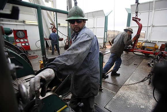 Mike Wipf operates the drill on a True Company oil drilling rig outside Watford, North Dakota.