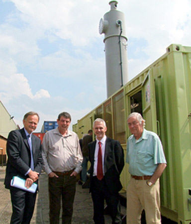 Stephen Tetlow (IMechE Chief Executive), Peter Harrison (AFS,CEO), Tim Fox (IMechE Energy and Environment Director) and Tony Marmont (AFS Founder) in front of the facility and the CO2 air capture tower.