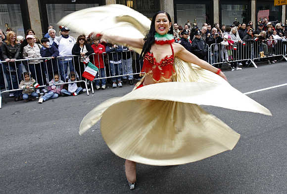 A woman takes part in the annual Columbus Day Parade up Fifth Avenue in New York.