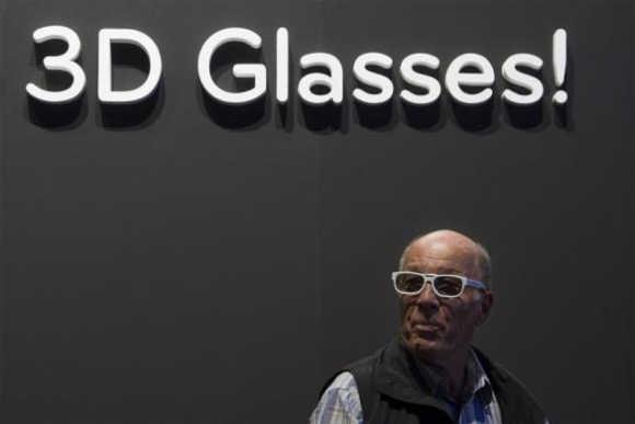 A man wears 3D glasses during a 3D TV presentation in the LG pavilion at the IFA consumer electronics fair in Berlin.