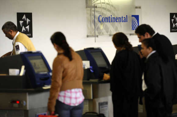 Travellers check in at Newark Liberty International Airport in Newark.