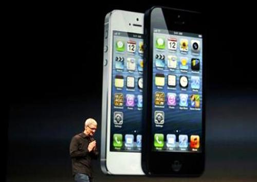 Apple Inc. CEO Tim Cook takes the stage after the introduction of the iPhone 5 during Apple Inc.'s iPhone media event in San Francisco, California.