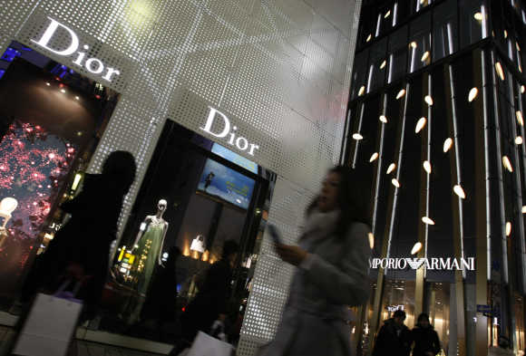 Christian Dior, left, and Armani Ginza Tower at Tokyo's Ginza shopping and amusement district.
