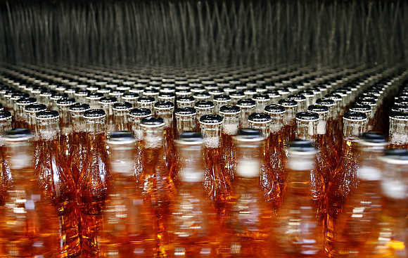 Bottles of Strongbow Gold cider are washed before packaging at the Stassen brewery in Aubel near Liege, Belgium.