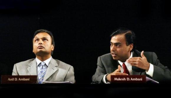 Mukesh Ambani (r) and Anil Ambani.