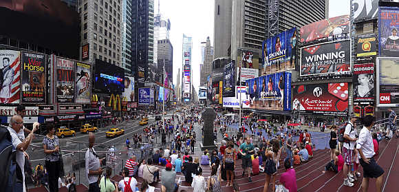 Tourits gather in Times Square in New York, United States.