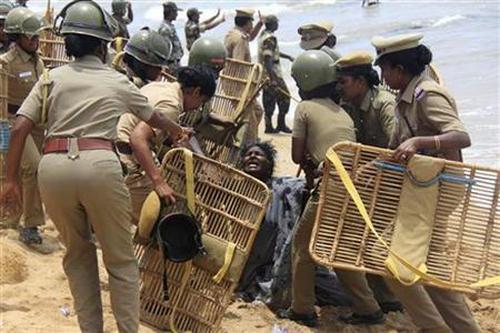 Police detain a demonstrator during a protest near a nuclear power project in Kudankulam in Tamil Nadu.