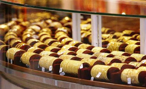 Gold ornaments displayed in a jewellery store.