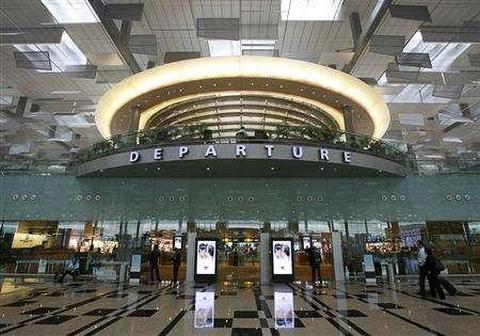 Passengers walk towards their departure gates in the newly opened Terminal 3 at Singapore's Changi Airport.