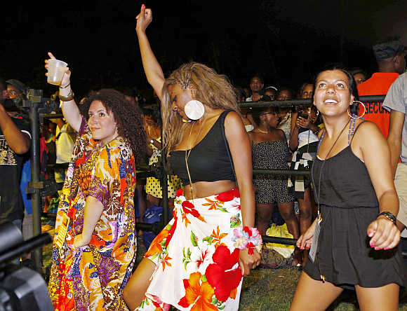 Music fans dance during the final day of the St Lucia Jazz Festival at Pigeon Island in St Lucia.