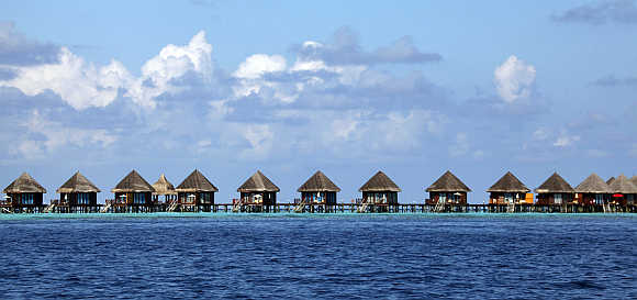 Tourist huts on a reef at a resort island in Male, Maldives.