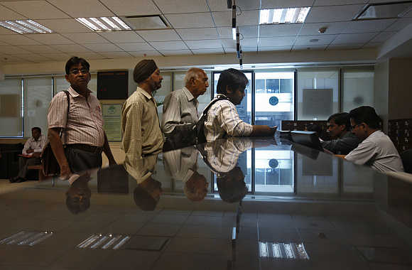 People submit their papers inside the Income Tax office in New Delhi.